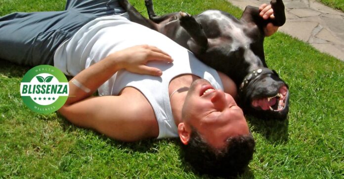 Man taking a sunbath laying on the grass